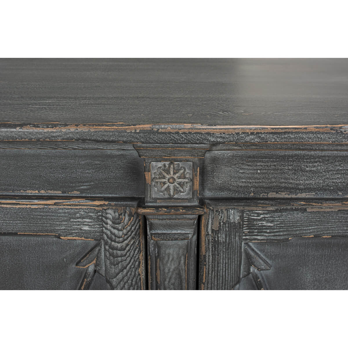 Decorative accent detail on gray French Directoire buffet.