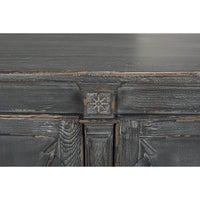 Decorative accent detail on gray French Directoire buffet.