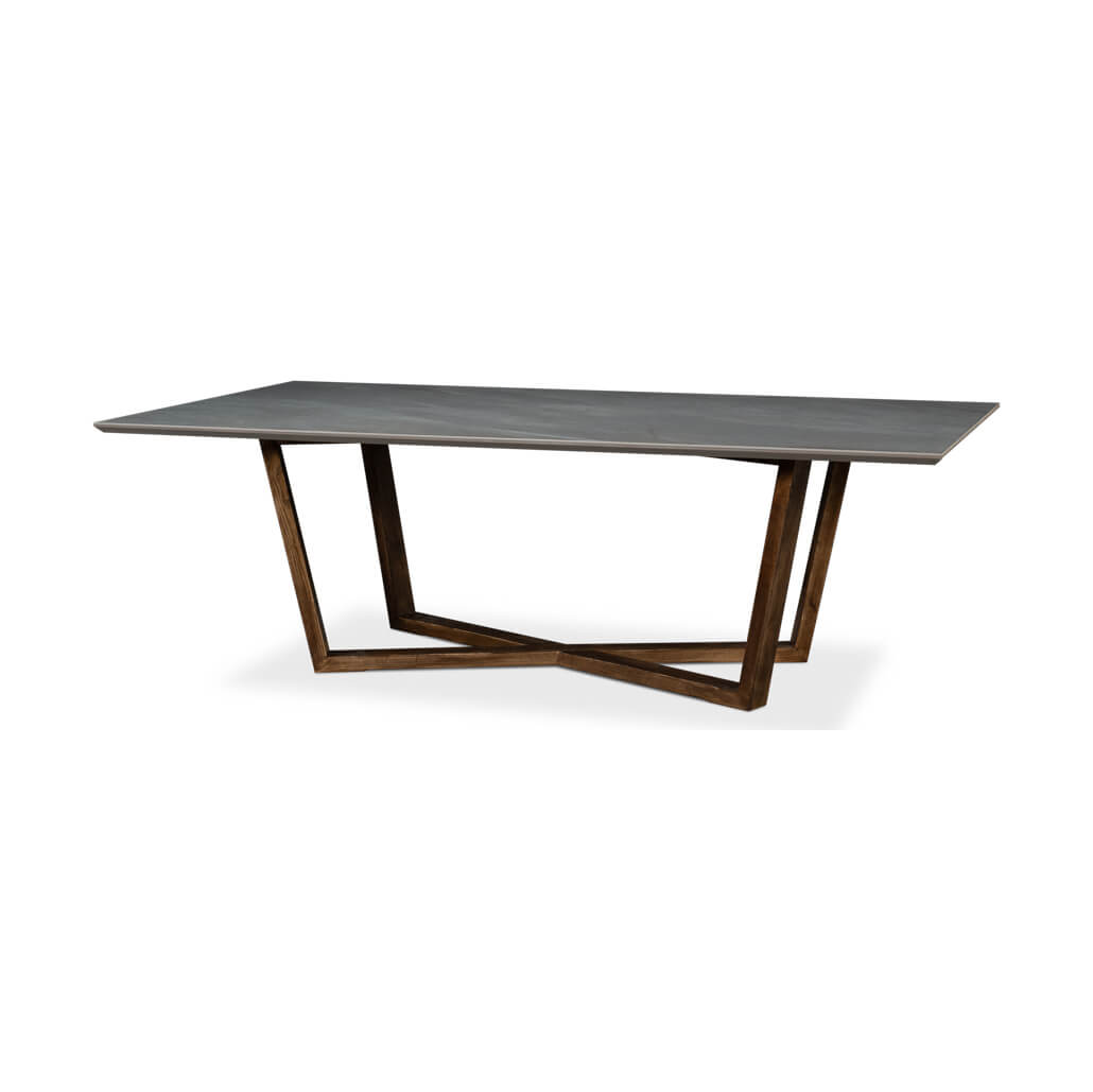 Angled view of gray porcelain dining table, wooden base.