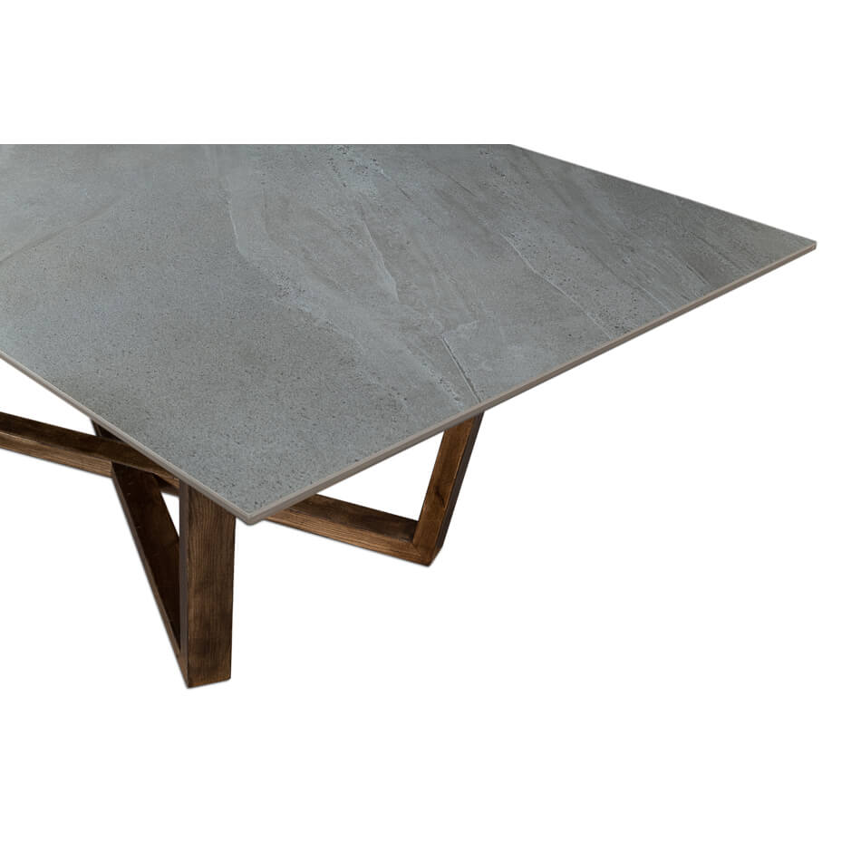 Close-up corner of gray porcelain dining table, texture detail.