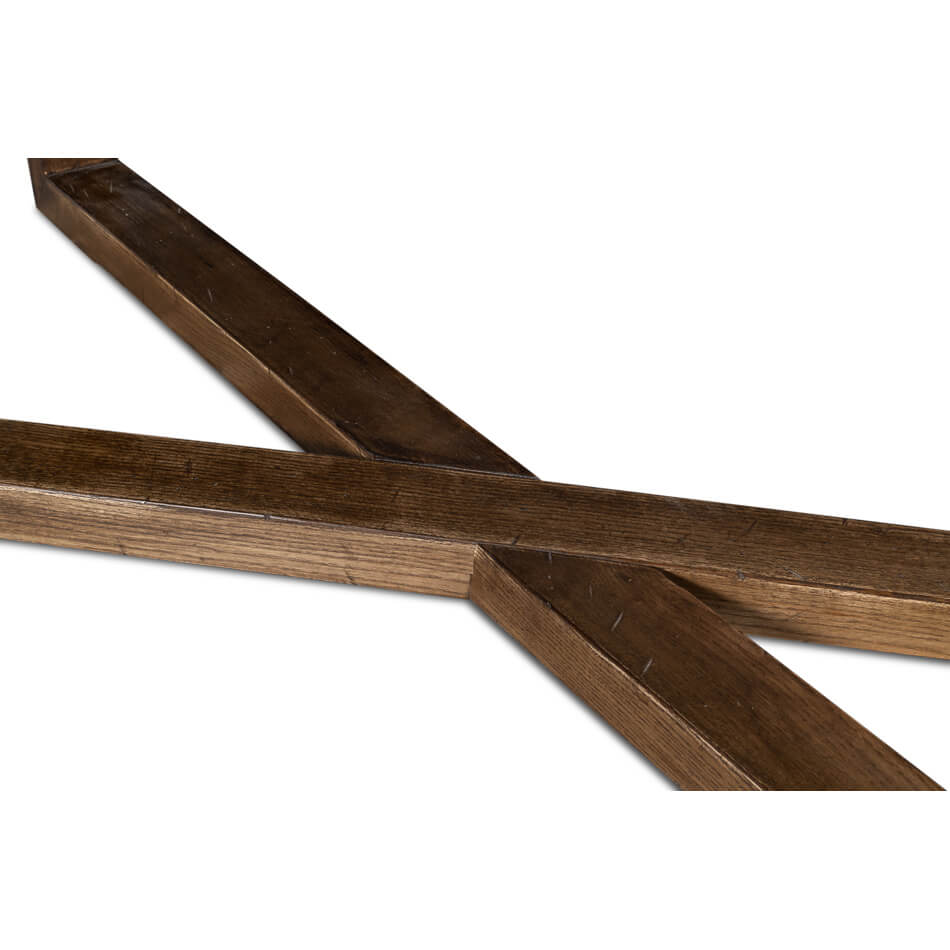 Close-up of table base, cross-legged wooden structure.