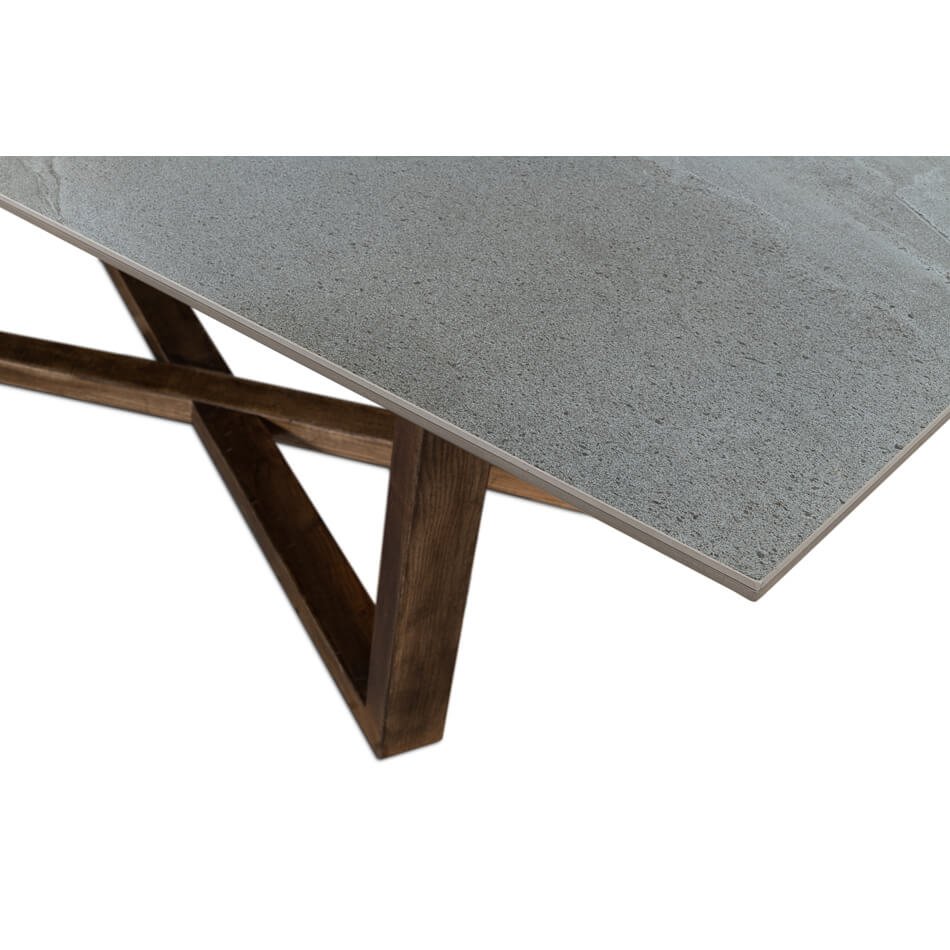 Detailed corner of gray porcelain dining table, polished surface.