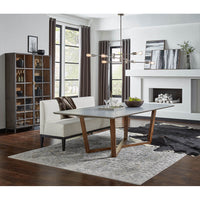 Gray porcelain dining table in styled living room setting.