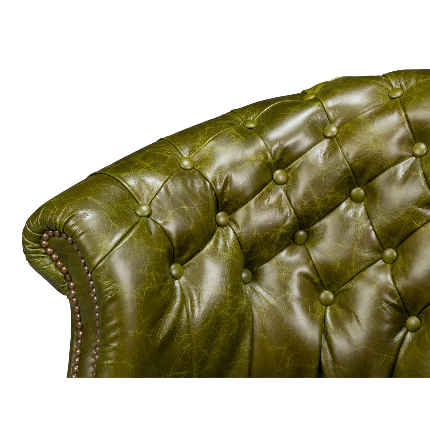 Green leather barrel back chair, backrest tufting detail.