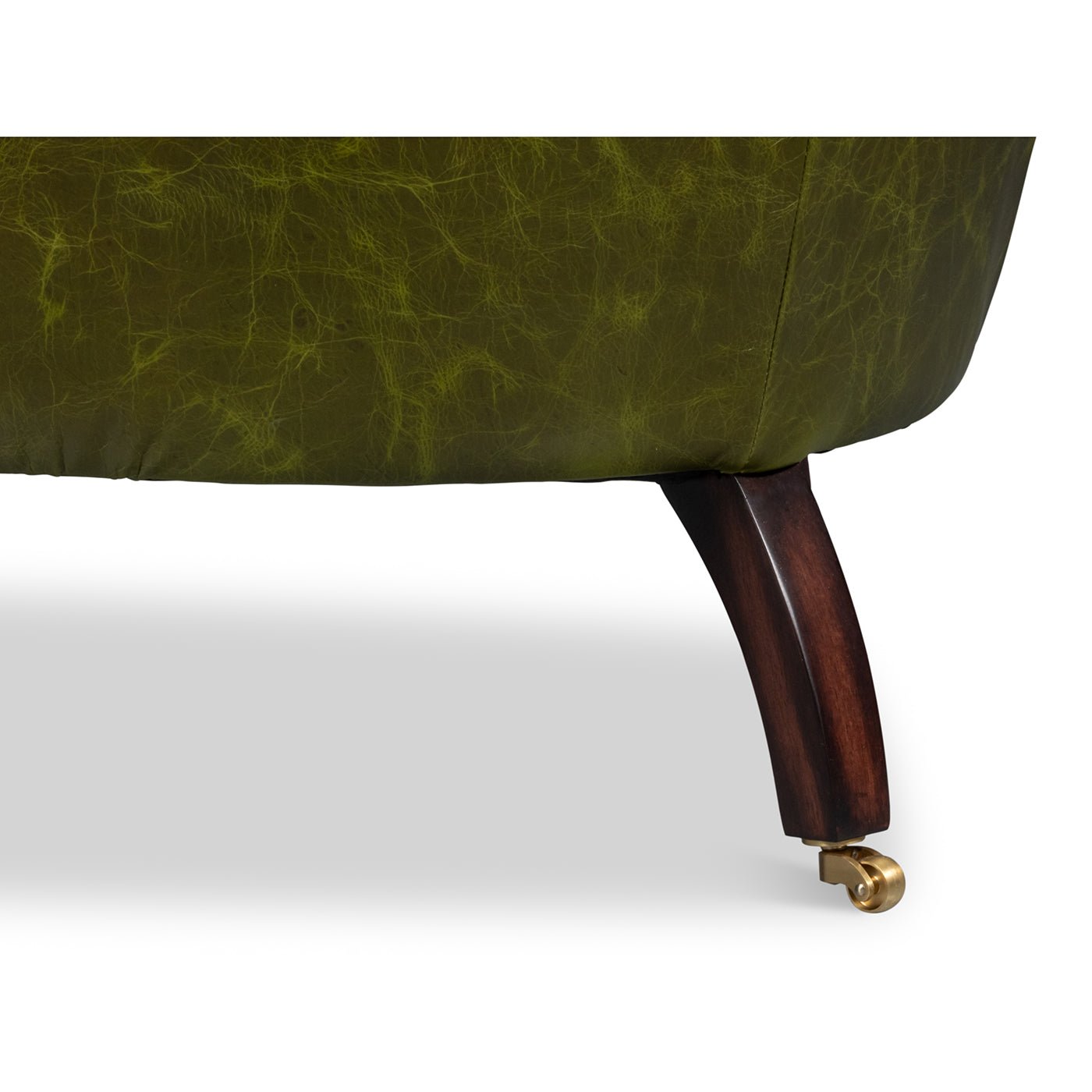 Green leather barrel back chair, back leg detail.