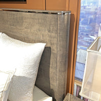 Close-up of Grey Art Deco bed frame headboard texture.