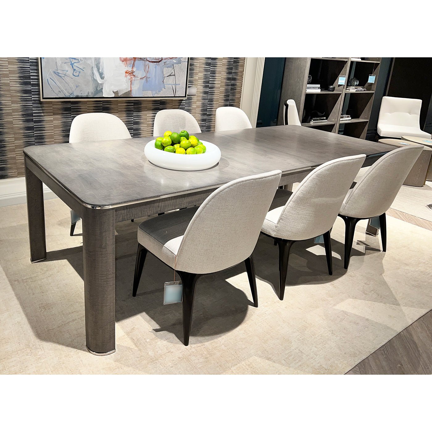 Dining table with chairs and decorative centerpiece.
