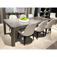 Dining table with chairs and decorative centerpiece.
