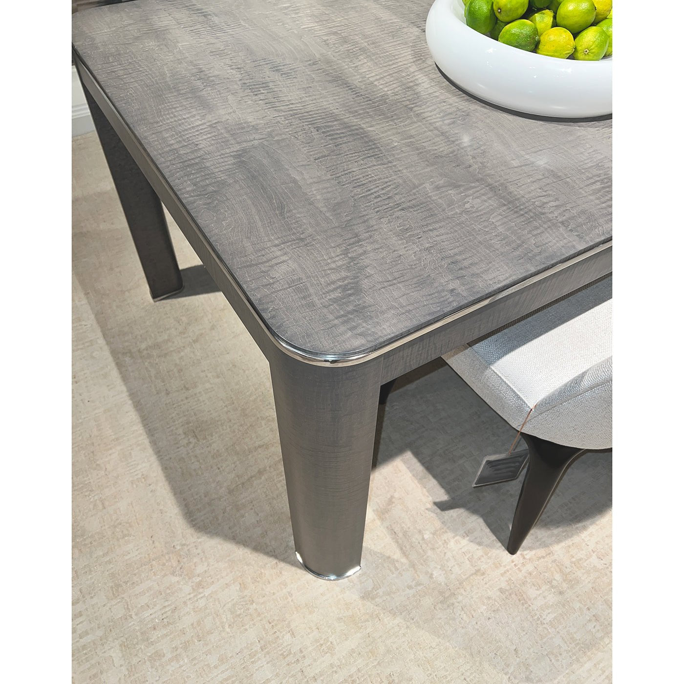 Top view of grey table surface and detailed corner.