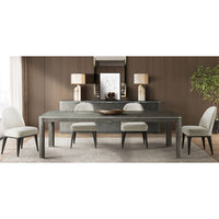 Dining table with chairs in stylish room setting.
