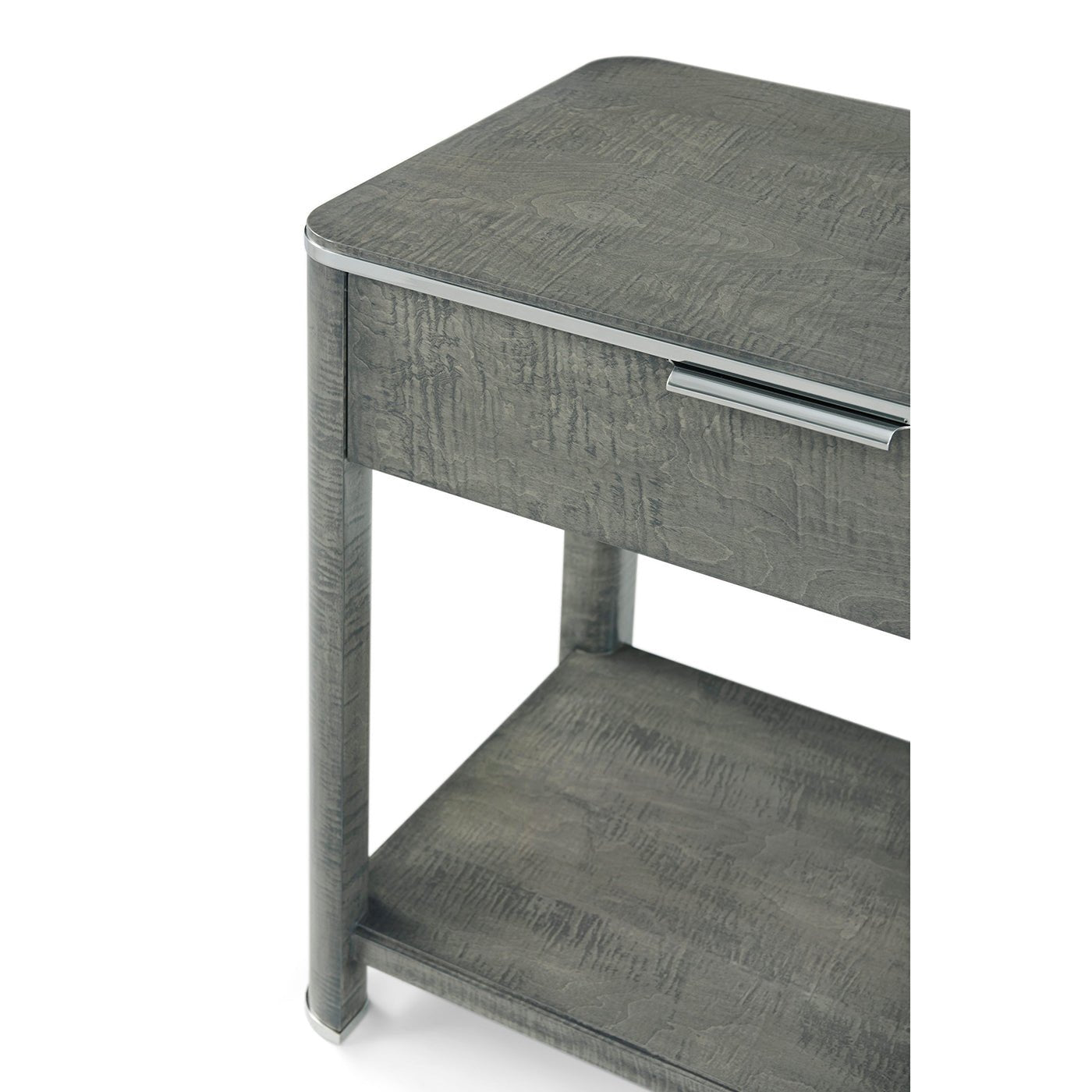 Close-up of nightstand's corner and drawer handle detail.