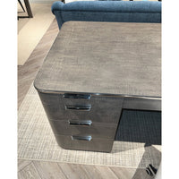 Top corner of pedestal desk with drawers.
