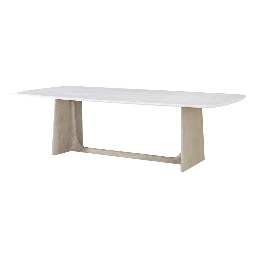 Angled view modern quartz top dining table, grey oak base.