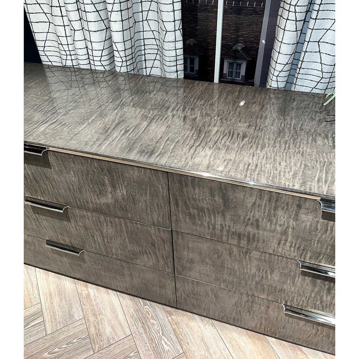 Close-up of dresser top surface, detailed texture.