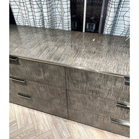 Close-up of dresser top surface, detailed texture.