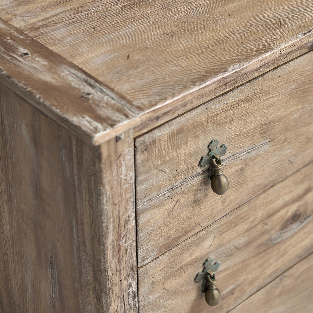 Greyed oak chest, top corner and wood grain detail.