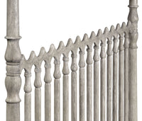 Headboard detailing of greyed oak four-post king bed.