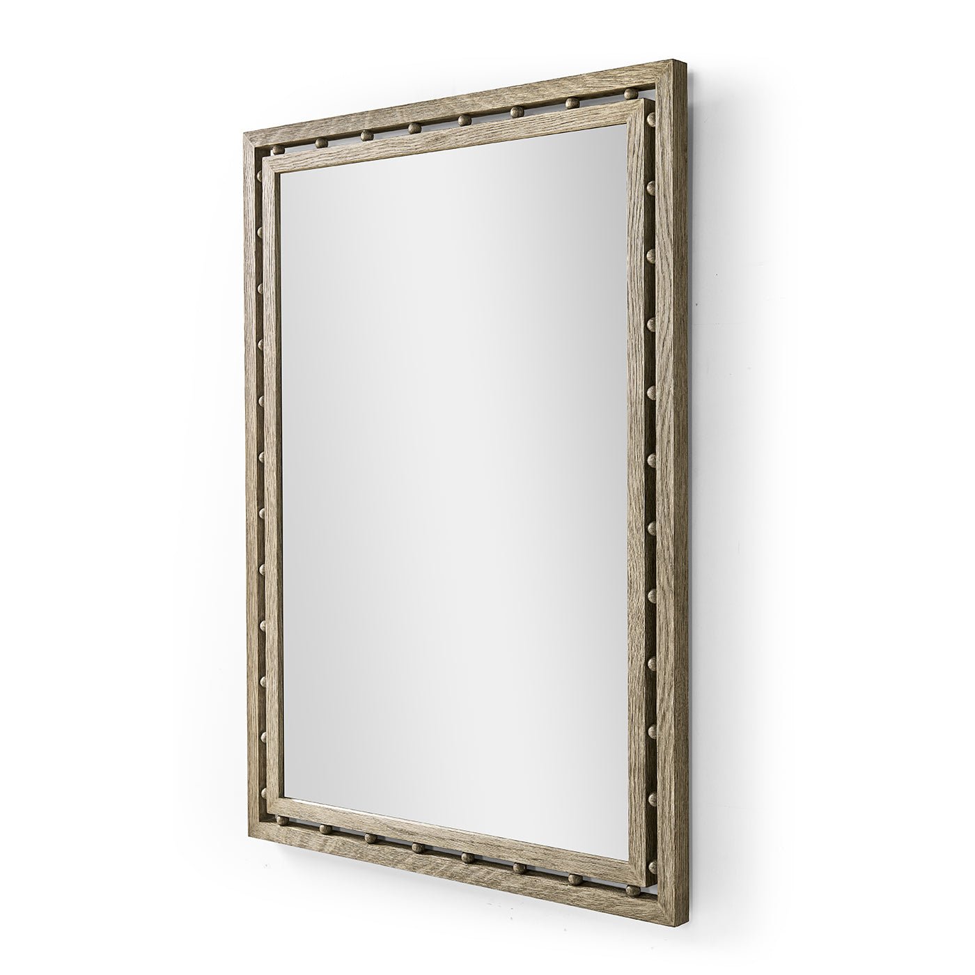 Angled view of rectangular greyed oak mirror