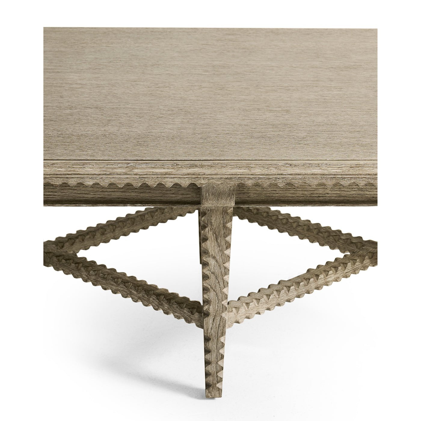 Rustic table corner with detailed leg construction.