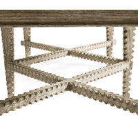 Close-up of rustic coffee table's intricate cross supports.