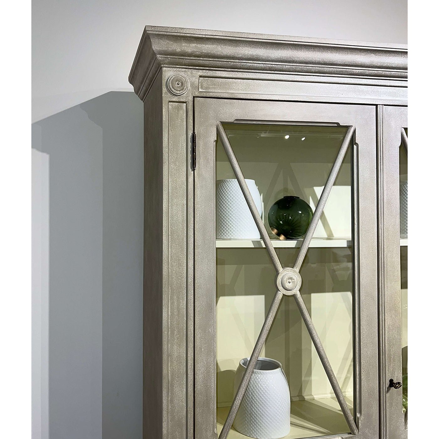 Gustavian display cabinet, detail of top corner and molding.