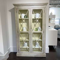 Gustavian display cabinet, styled with white vases, showroom setting.