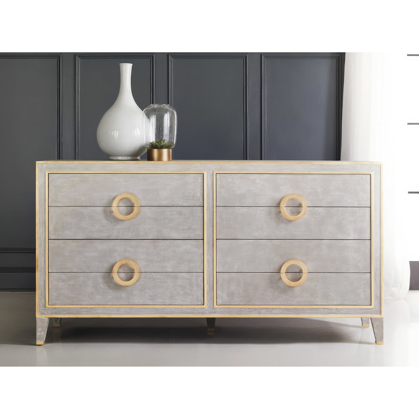 Grey dresser with gold accents, front view.