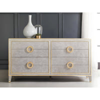 Grey dresser with gold accents, front view.