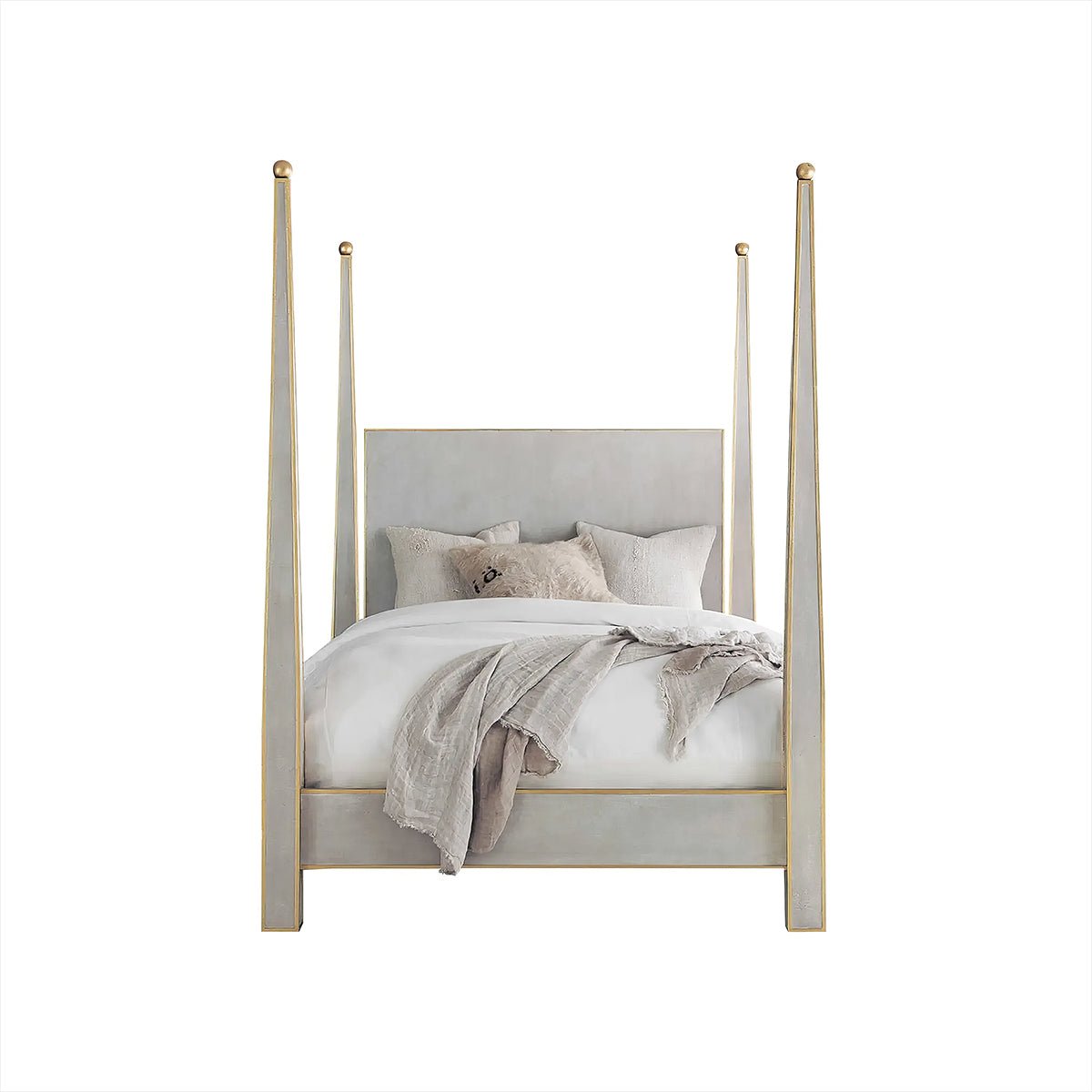 Front view of four-poster bed with pillows.