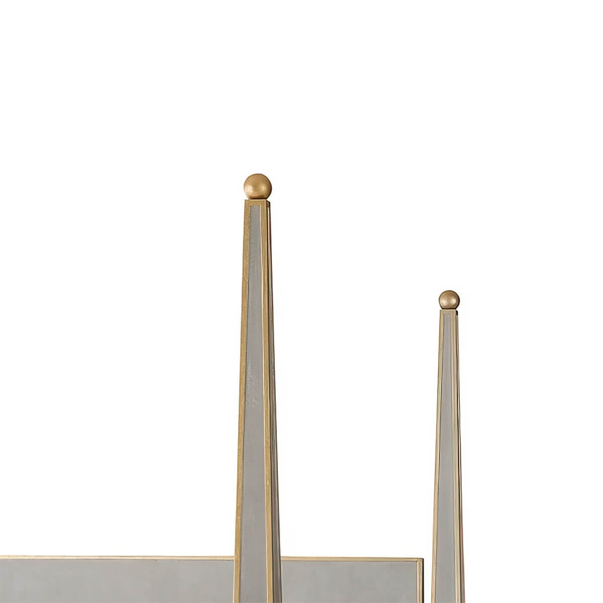 Bed posts close-up, gold top accents shown.