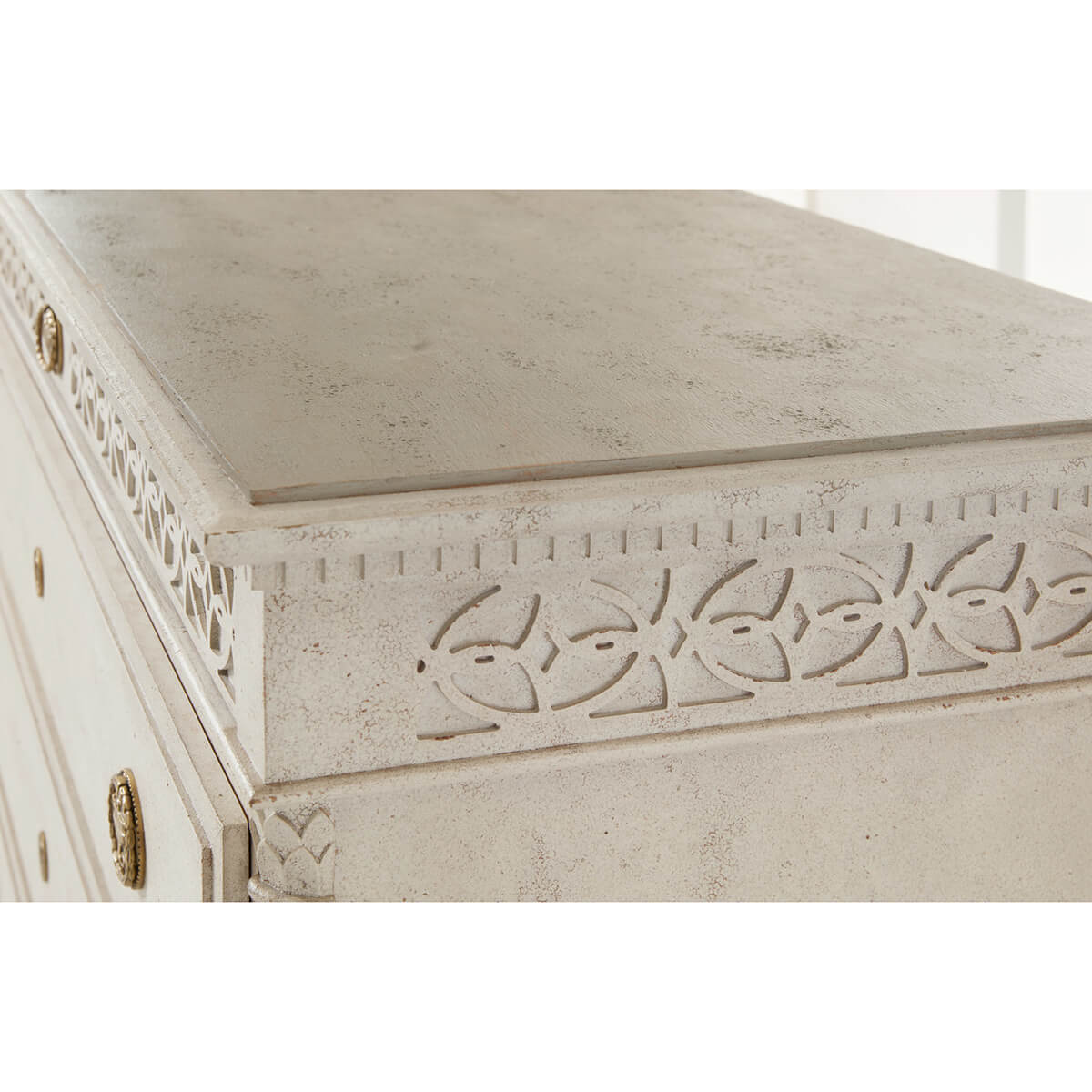 Close-up of dresser's carving and textured finish.