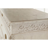 Close-up of dresser's carving and textured finish.