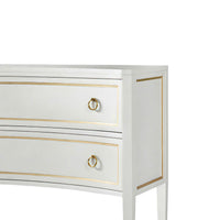 Close-up of dresser side panel, gold trim detail.