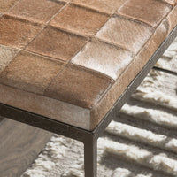 Angled close-up of the Canyon Sand bench seat corner and the geometric embossing on its iron frame