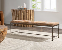 Canyon Sand hair-on-hide bench on a pale rug in a living room with wood furniture