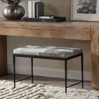 Compact Sparrow Gray hair-on-hide bench with a black iron frame beneath a rustic wood console