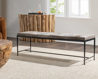 Sparrow Gray hair-on-hide bench with black iron frame on a cream rug beside rustic wood furniture