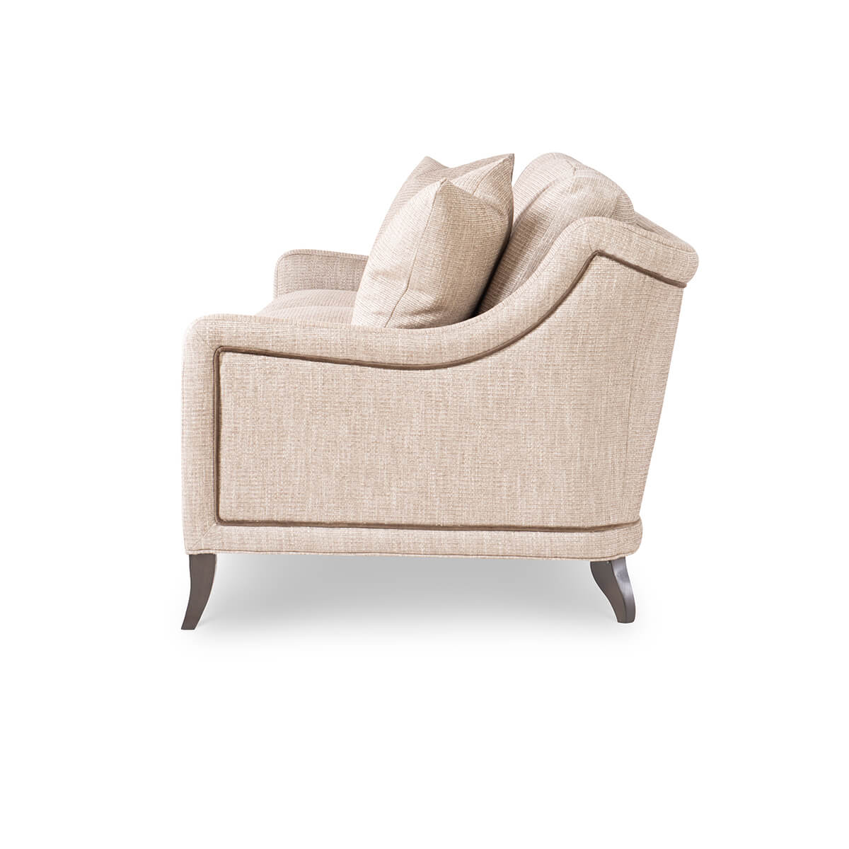 Beige modern sofa, side profile with curved armrest.