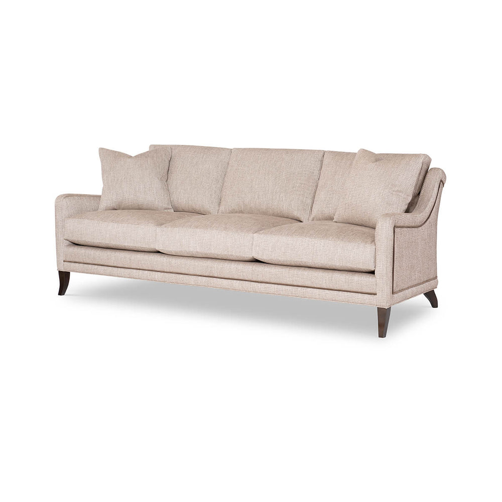 Beige modern sofa, angled front view with cushions.