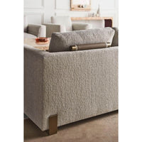 Close-up of Harmony Modern Sofa's textured fabric and legs.