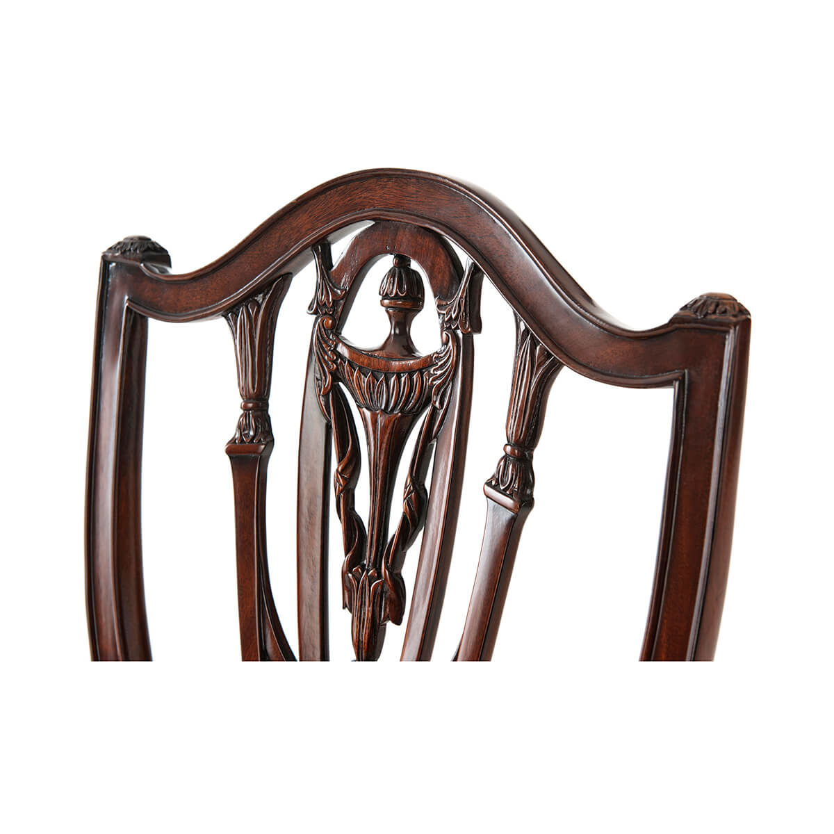Detailed Hepplewhite armchair back design, intricate woodwork close-up.