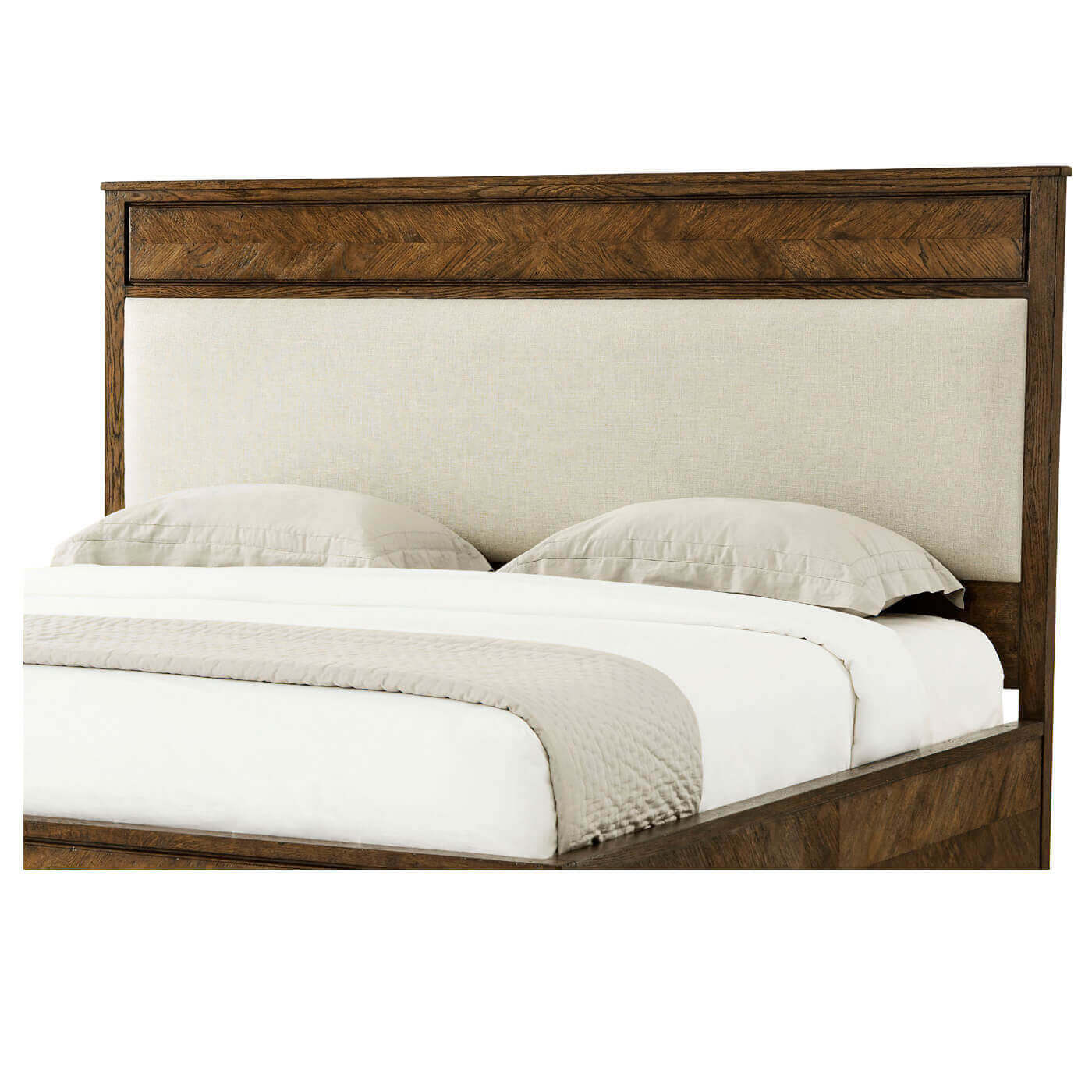 Close-up of headboard on herringbone parquetry king bed.