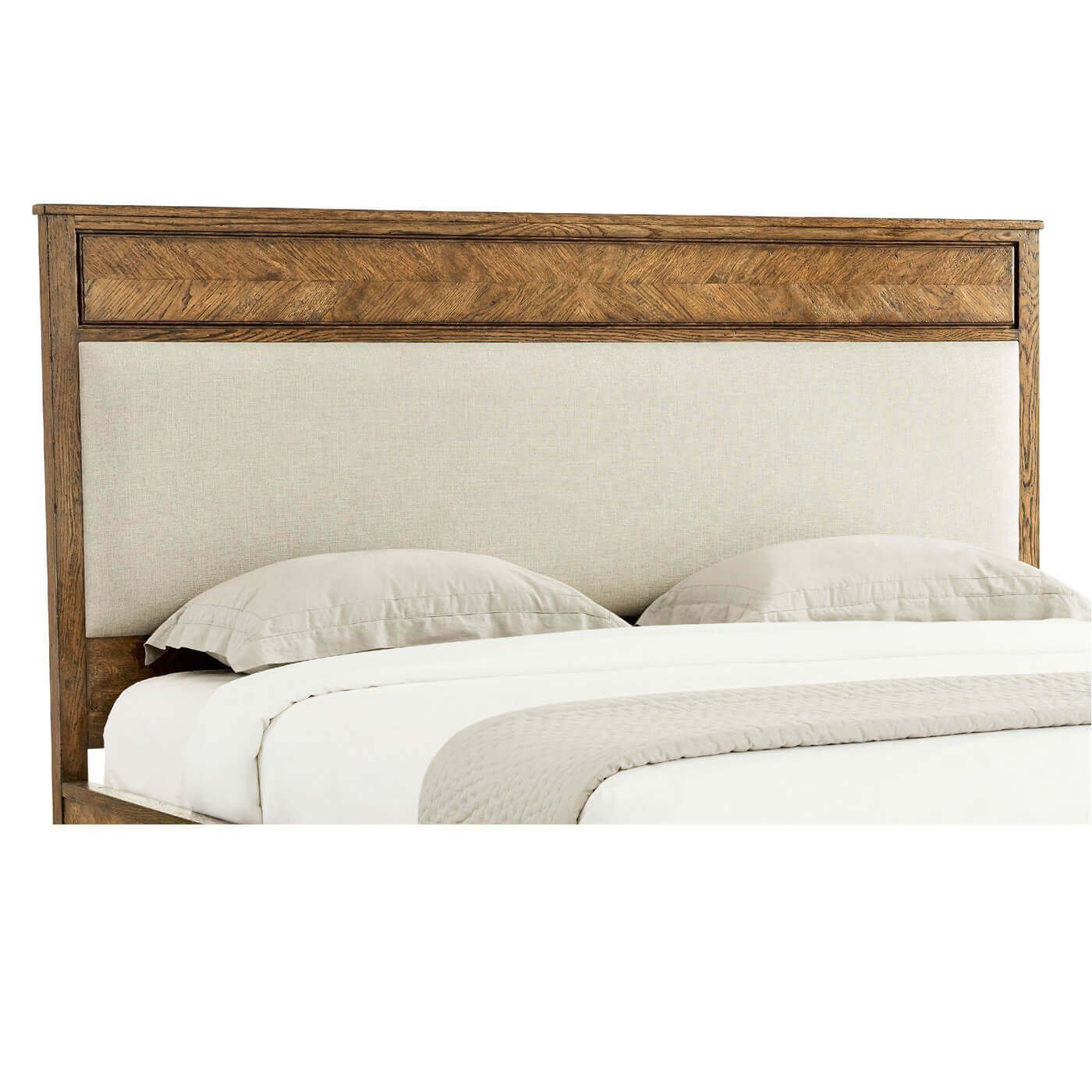 Light oak bed headboard with pillows, close-up view.