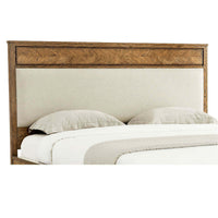 Light oak bed headboard with pillows, close-up view.
