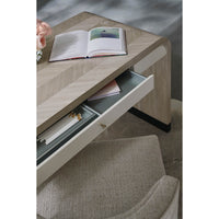 Close-up of desk drawer with organizer and stationery.