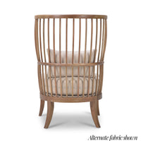 Back view of high-back spindle armchair, beige cushion.