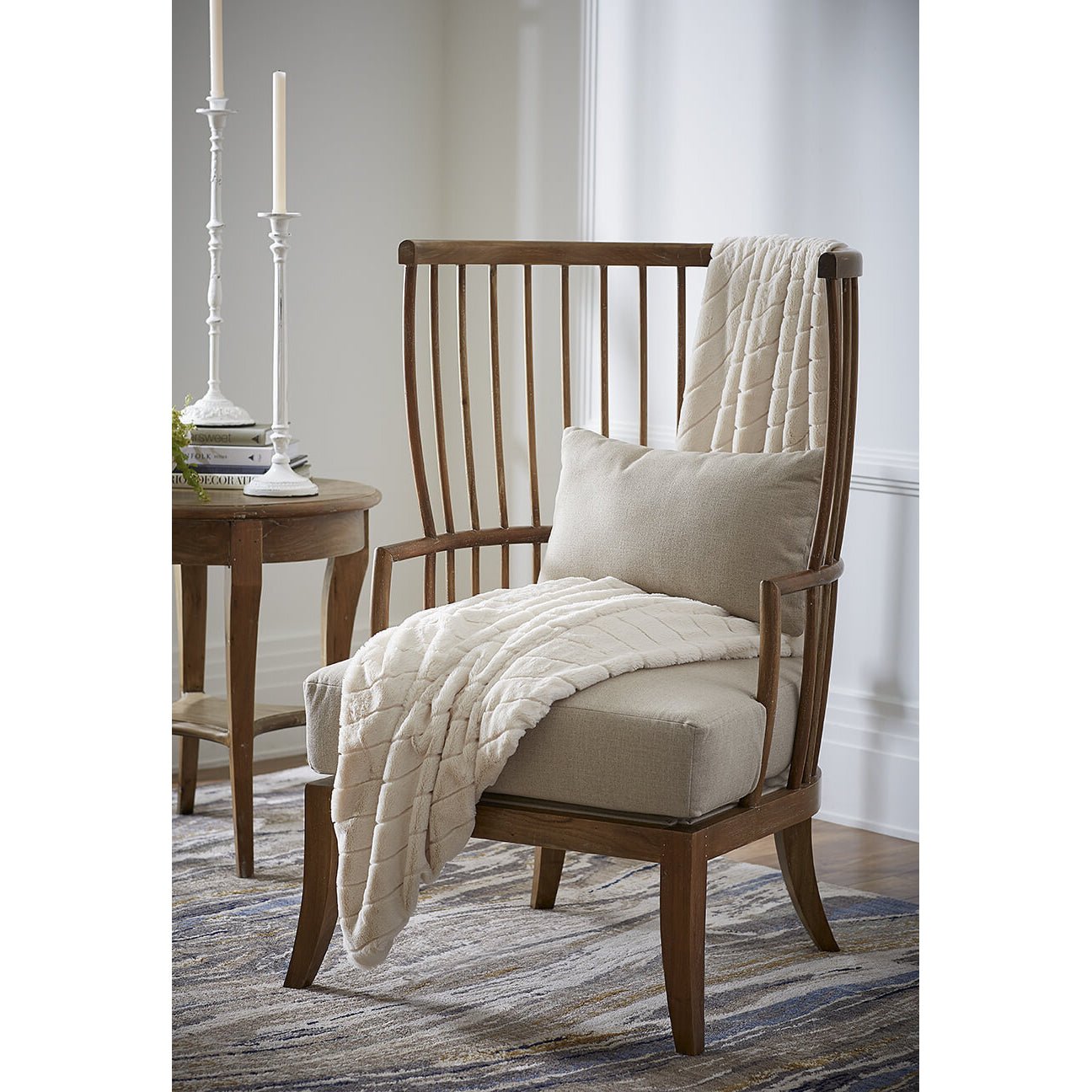 High back spindle armchair, staged in room setting.