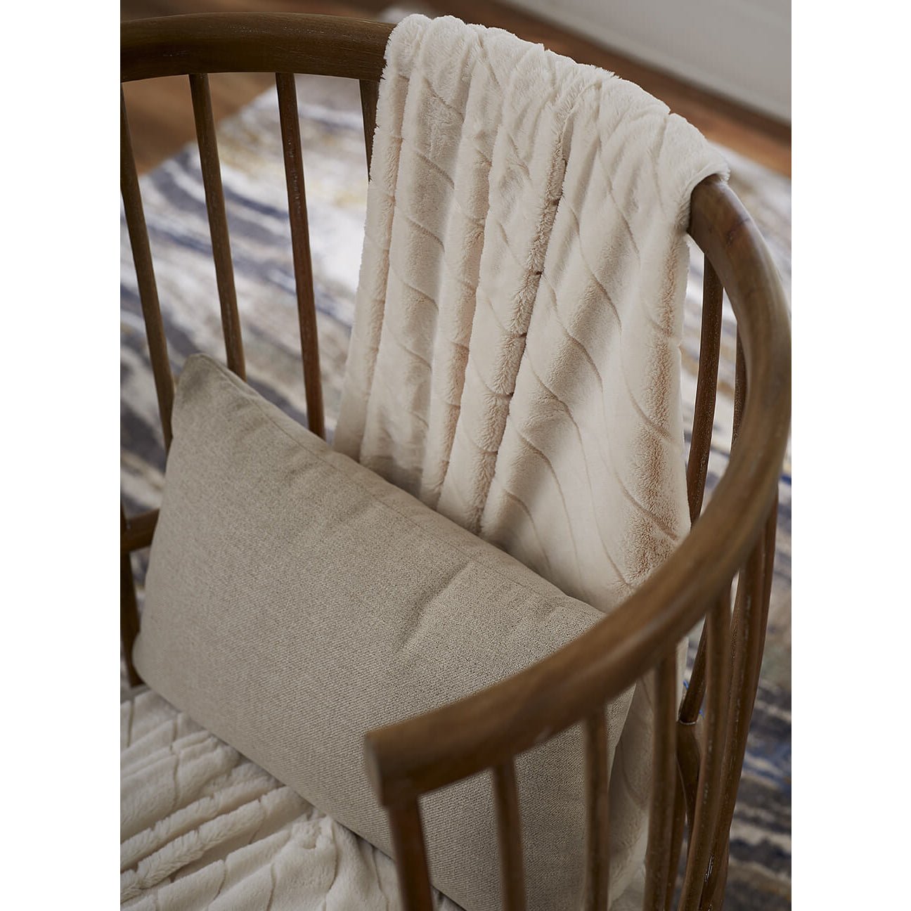High back spindle armchair, close-up with blanket.
