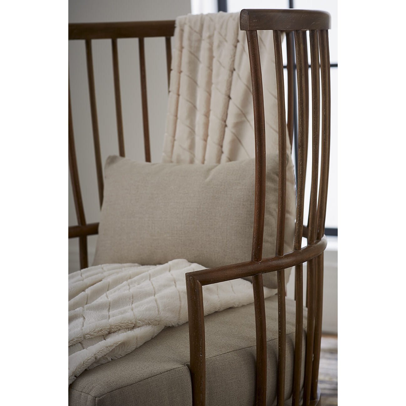 High back spindle armchair, side detail with blanket.