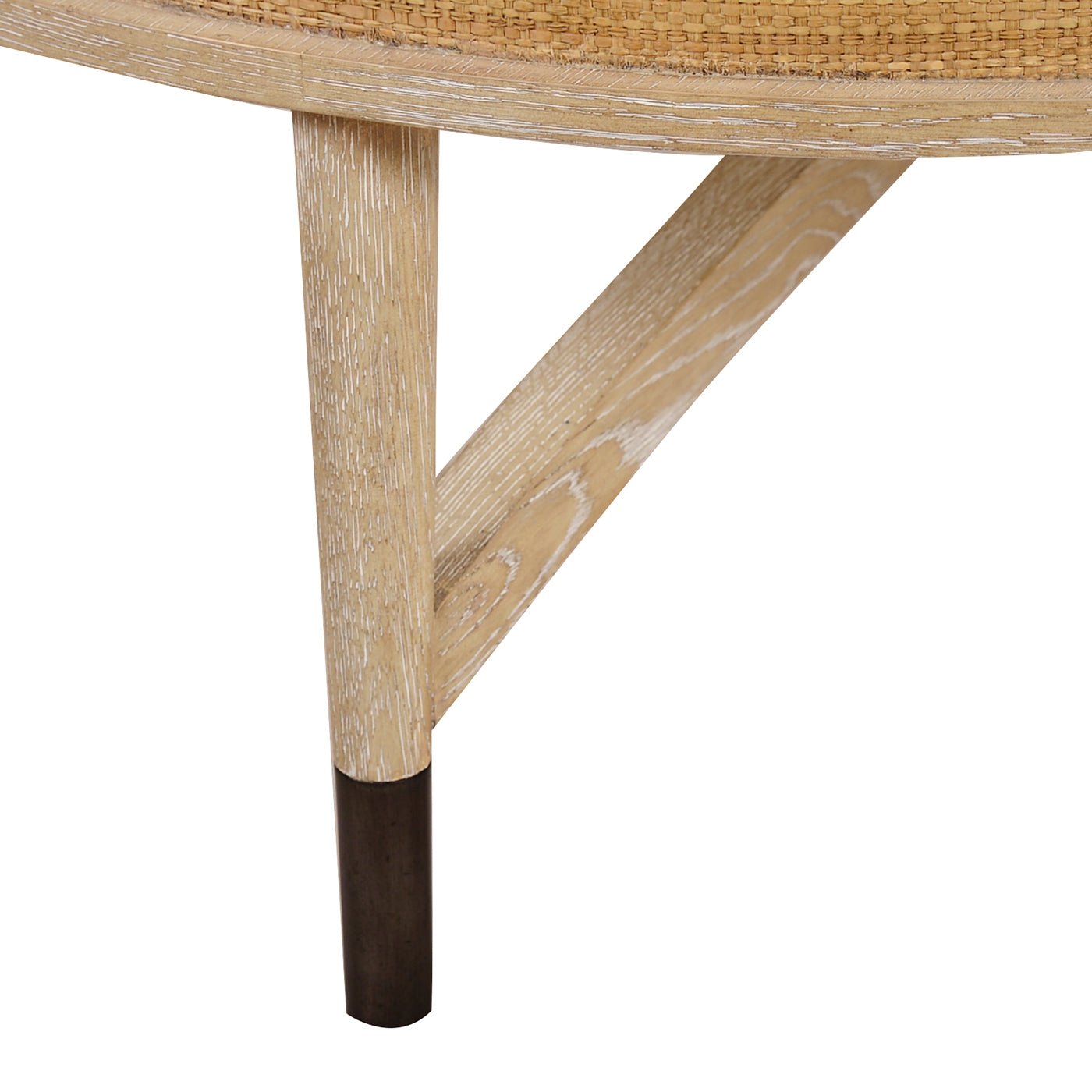 Coffee table leg detail with contrasting metal tip.